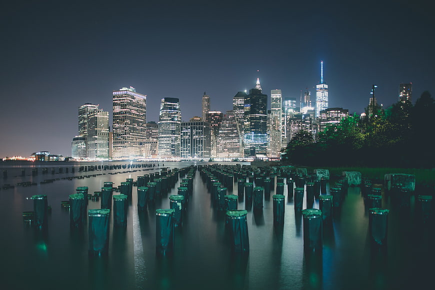 New York City Skyline at Night with Water Reflections