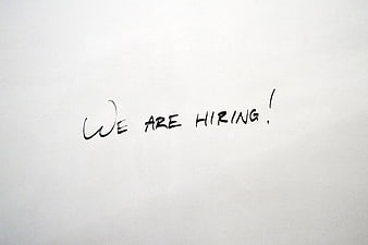 Handwritten We Are Hiring Text on White Paper