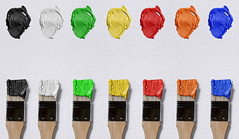 Colorful Paint Brushes and Dabs on White Canvas Background
