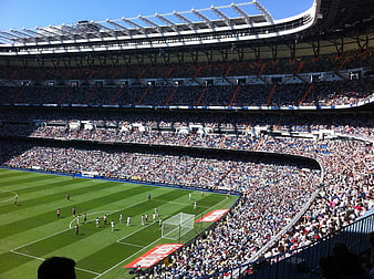 Wide View of Packed Football Stadium During Match