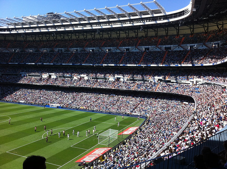 Wide View of Packed Football Stadium During Match