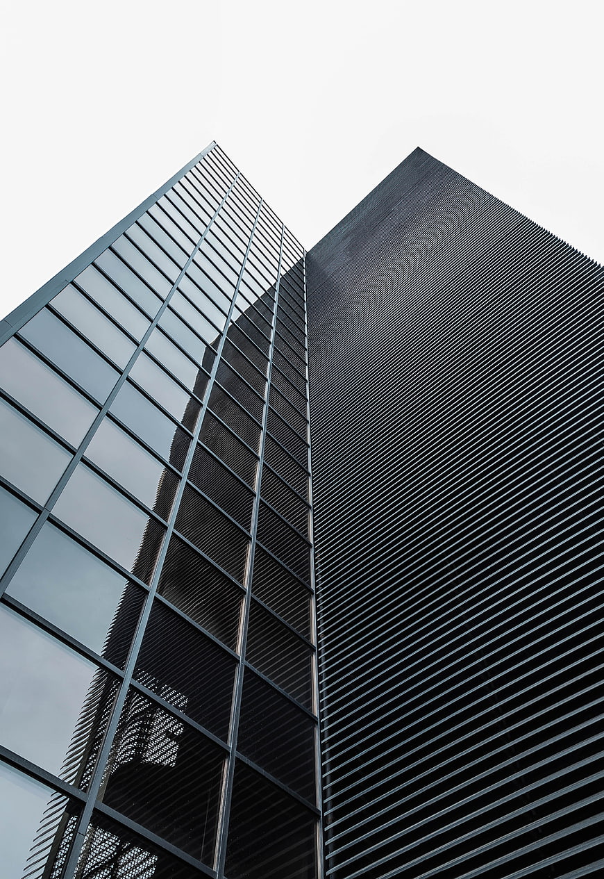 Low angle view of modern skyscrapers with glass and metal facades