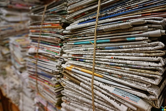 Stack of old newspapers tied with jute rope