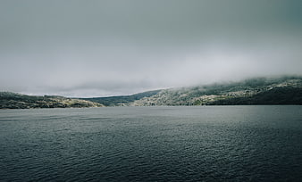 Misty Mountain Lake Landscape with Overcast Sky