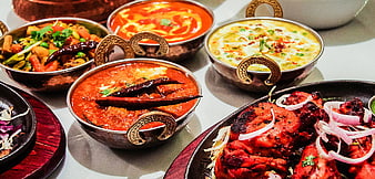 Assorted Indian Cuisine in Traditional Copper Bowls