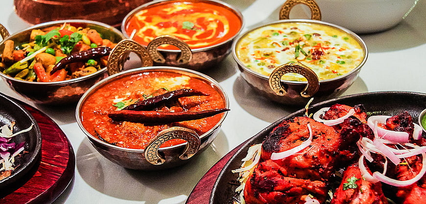 Assorted Indian Cuisine in Traditional Copper Bowls