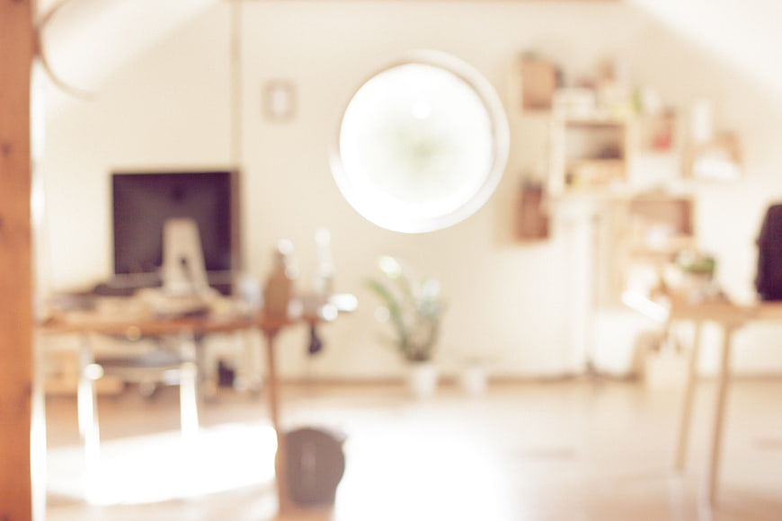Blurred Bright Home Office Interior with Round Window