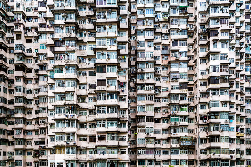 Dense Urban Housing Facade with Windows and Air Conditioners
