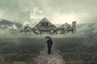 Silhouette of person with umbrella walking toward stormy house