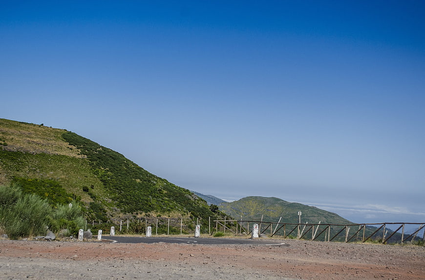 Mountain Road Viewpoint with Blue Sky and Green Hills