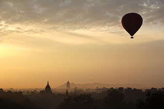 Hot Air Balloon Silhouette Over Bagan Temples at Sunrise