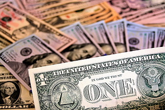 Close-up of US Dollar Bills with One Dollar Bill in Focus