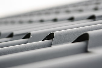 Close-up of gray corrugated metal roofing sheet texture
