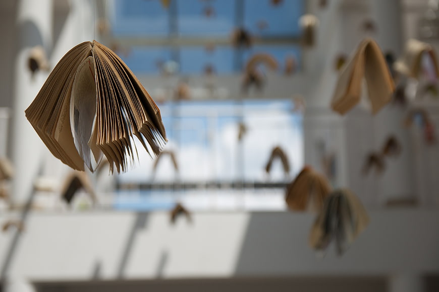 Hanging Open Books Art Installation in Modern Library