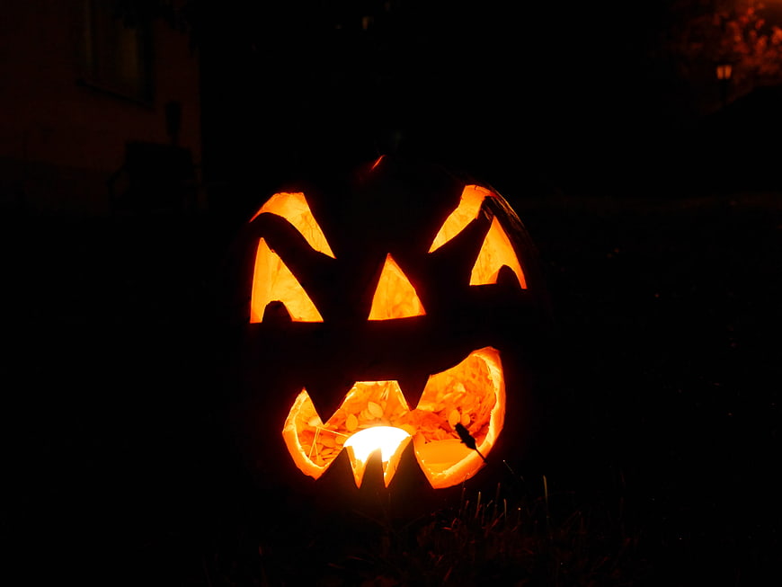 Glowing Jack-O-Lantern Pumpkin Face in Dark Night