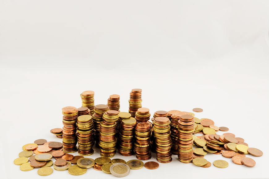 Stacks of Euro Coins on White Background