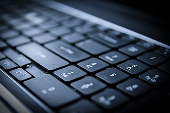 Close-up of black laptop keyboard with shallow depth of field
