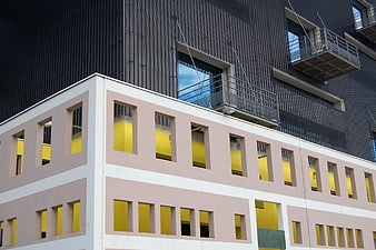 Modern Architecture with Pink Facade and Yellow Windows