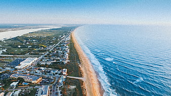 Aerial View of Coastal Town and Ocean Beach