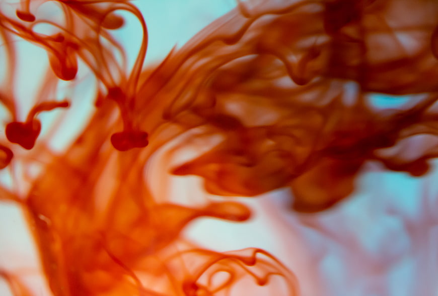 Abstract Red Ink Swirling in Water