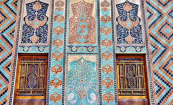 Intricate Persian Tile Mosaic Facade with Blue and Orange Patterns