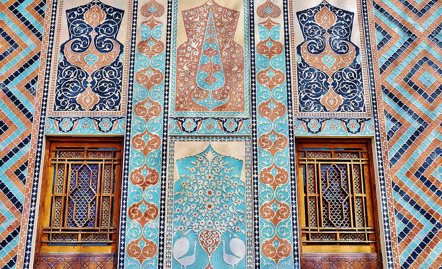 Intricate Persian Tile Mosaic Facade with Blue and Orange Patterns