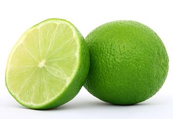Fresh Green Lime Whole and Halved on White Background