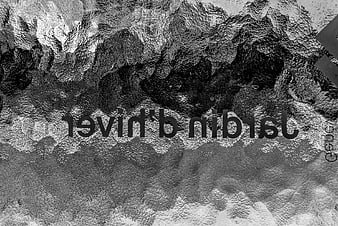 Black and white abstract texture of frosted glass with reversed text