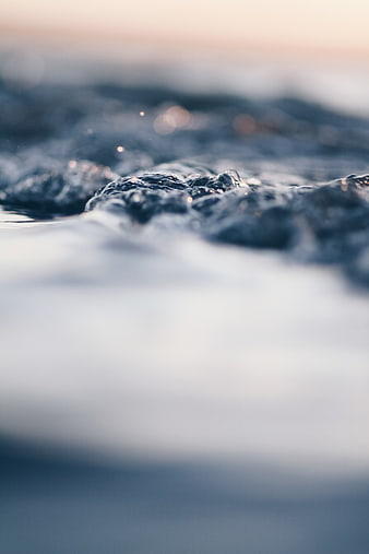 Close-up of ocean waves with soft focus and bokeh
