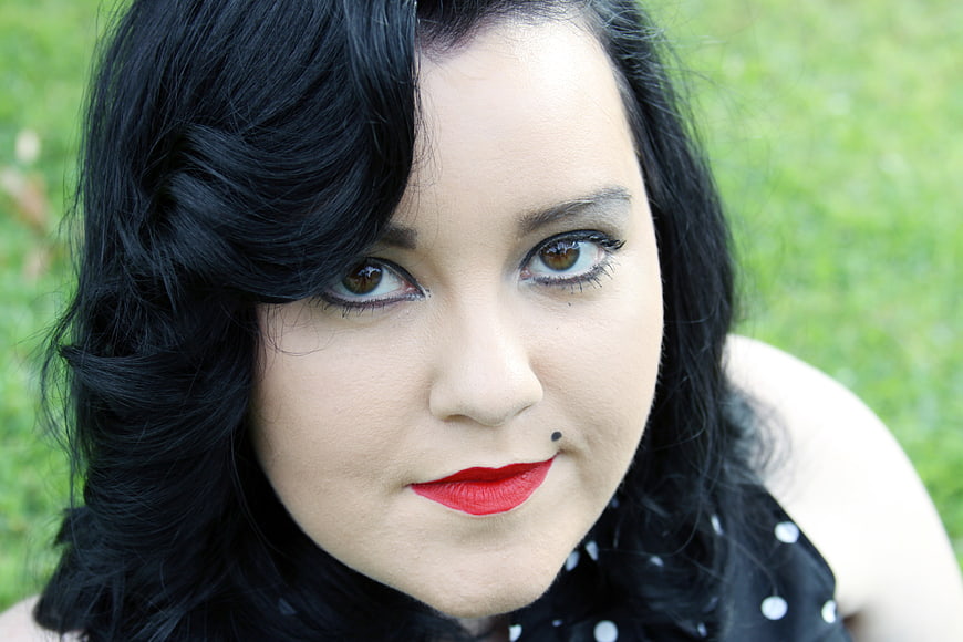Close-up portrait of woman with retro makeup and red lips