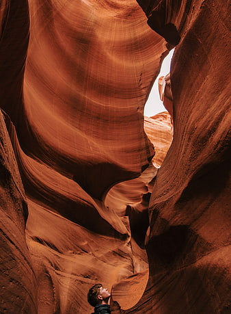 Man looking up inside Antelope Canyon slot canyon