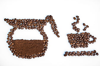 Coffee beans arranged as pot and cup on white background
