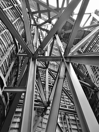Black and white low angle view of steel bridge truss structure