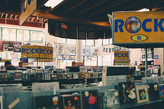 Interior of a vintage record store with rock music sections