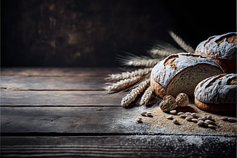 Rustic Artisan Bread Loaves with Wheat on Dark Wood