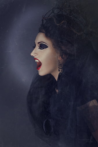 Gothic Vampire Woman Portrait With Dark Makeup And Fangs