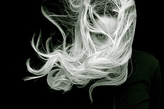 Dramatic Black and White Portrait of Woman with Windblown Hair