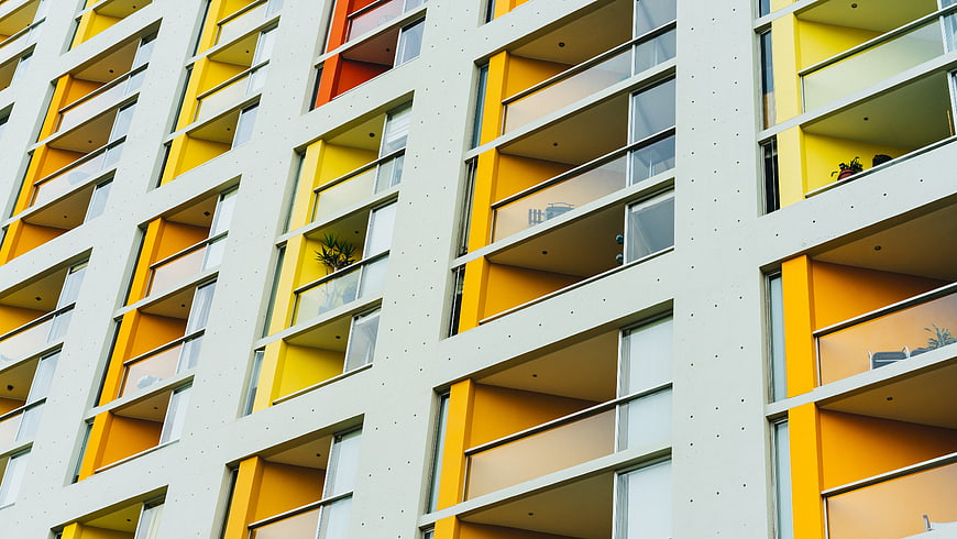 Modern Yellow and White Apartment Building Facade