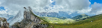 Panoramic Dolomites Mountain Landscape with Clouds and Green Valleys