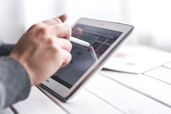 Hand Using Stylus on Tablet Computer