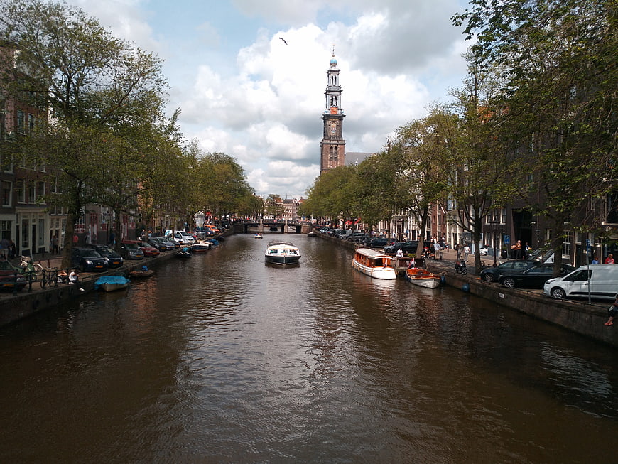 Amsterdam Canal View with Church Tower and Boats