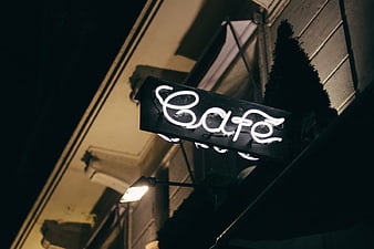 Glowing Neon Cafe Sign at Night