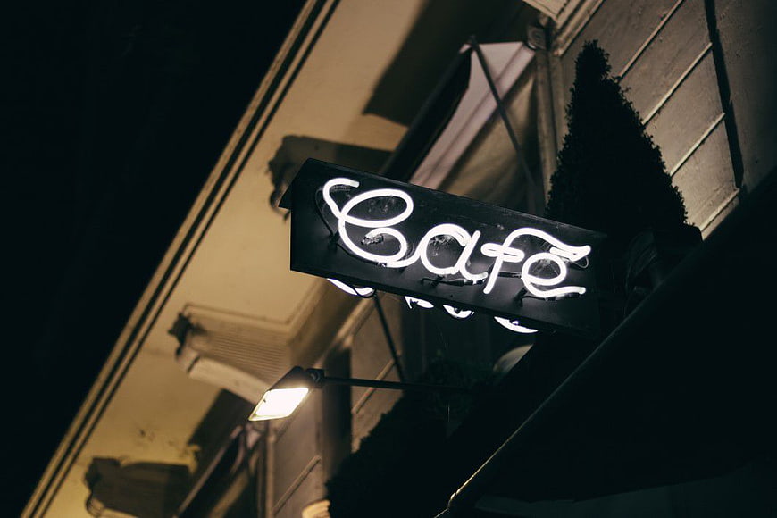 Glowing Neon Cafe Sign at Night