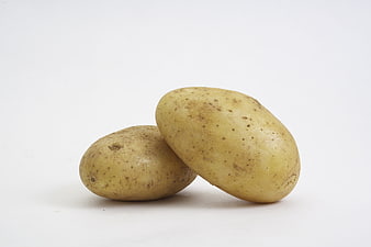 Two Raw Potatoes Isolated on White Background