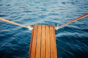Wooden Gangway Planks Over Blue Ocean Water