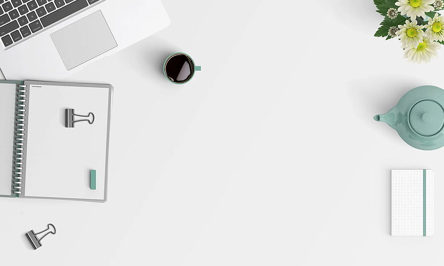 Minimalist white workspace flat lay with laptop, coffee, and flowers