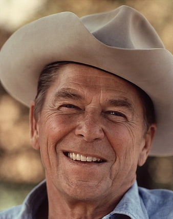 Close-up portrait of smiling senior man in cowboy hat