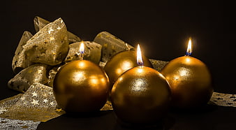 Gold Advent Candles With Starry Ribbon On Black Background
