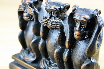 Three Wise Monkeys Wooden Figurines Close Up