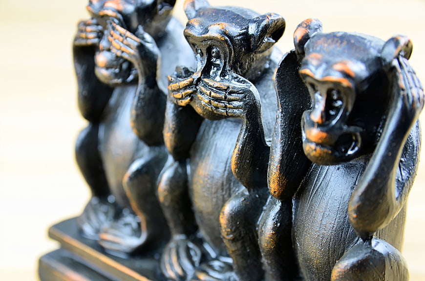 Three Wise Monkeys Wooden Figurines Close Up